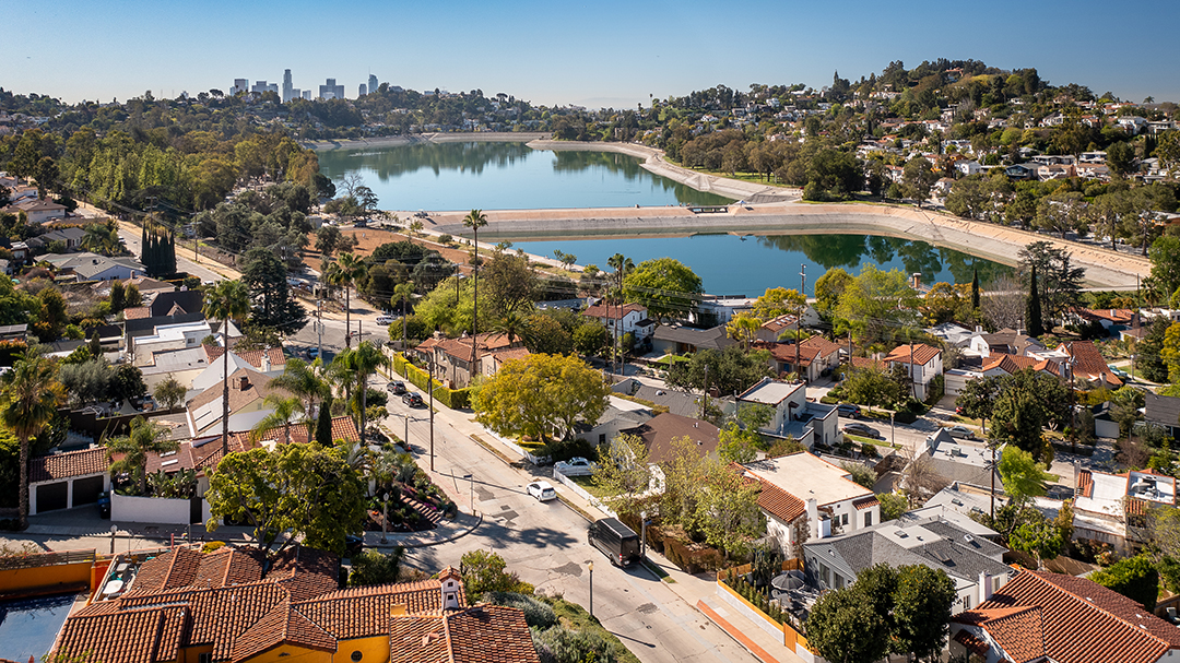 Aerial image of Silver Lake Reservoir complex with Downtown Los Angeles in the background. Photo by Erik Grammer