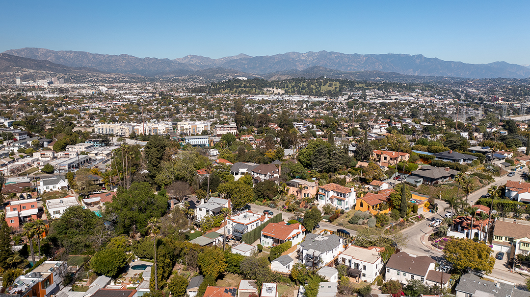 Aerial image of Silver Lake home with mountains in the background. Photo by Erik Grammer